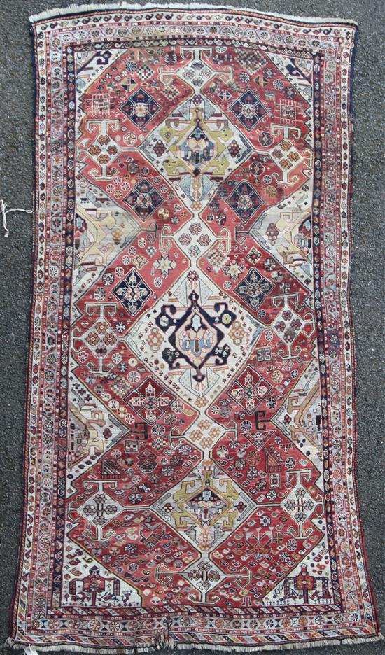 A Turkish rug, 8ft 1in by 4ft 1in.